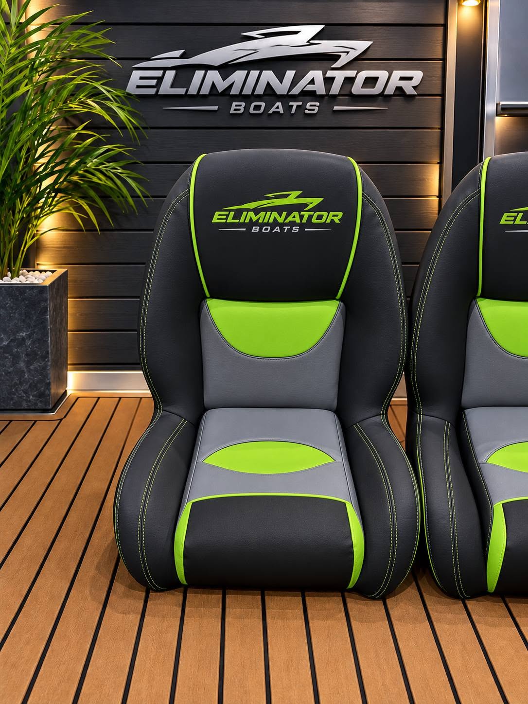 Black, grey and lime Eliminator boat seat with the Eliminator Boats logo